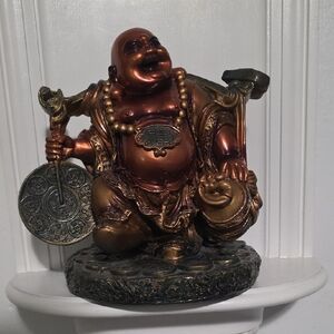 This figurine is a Feng Shui Laughing Buddha statue, Good Luck
